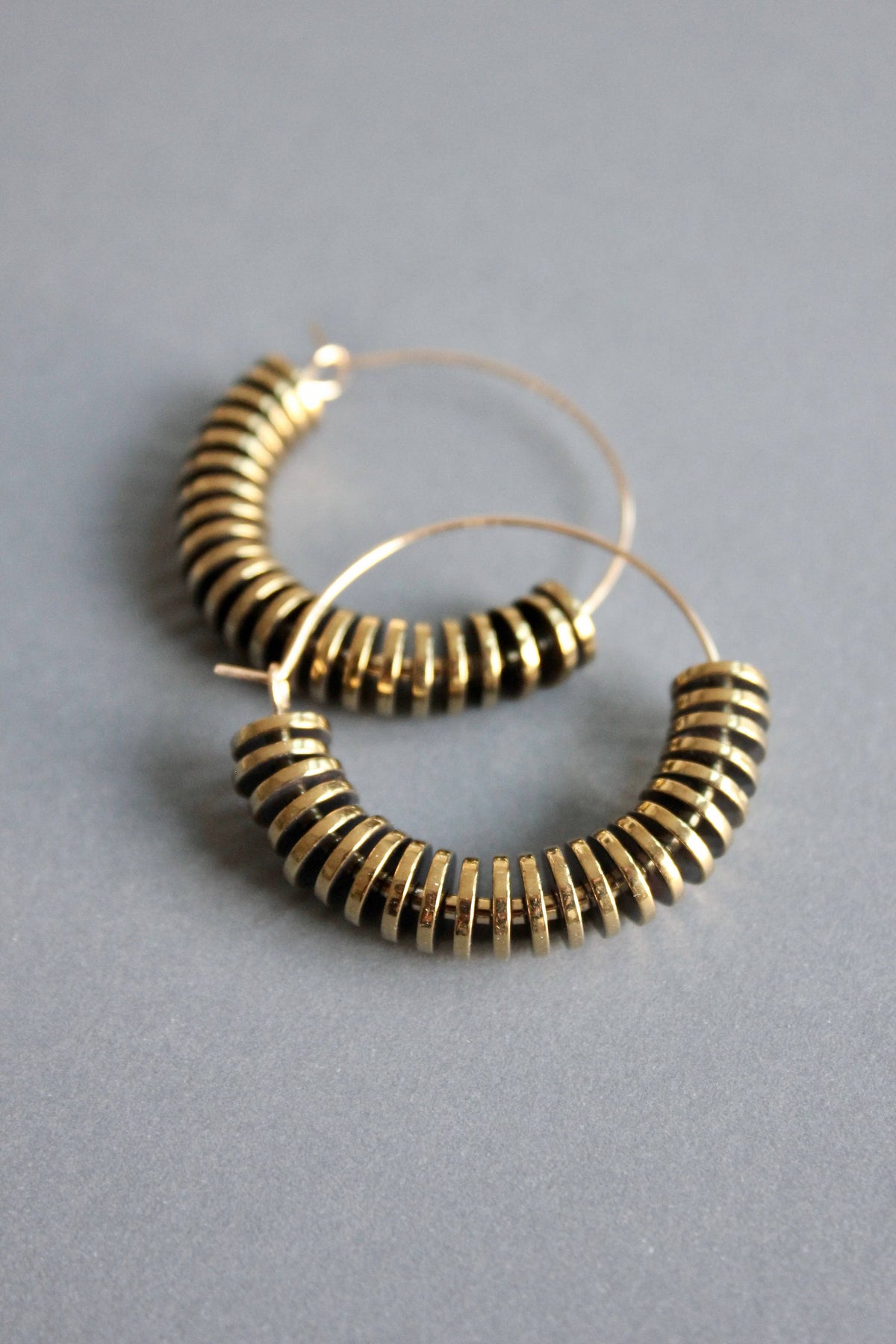 David Aubrey  Gold hematite hoop earrings
