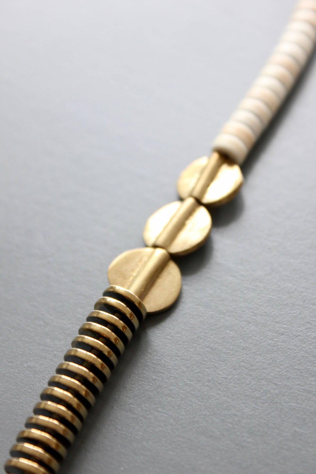 David Aubrey  Gold hematite and white disc necklace